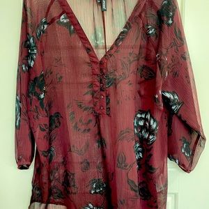 Cute maroon blouse with beautiful flower design.